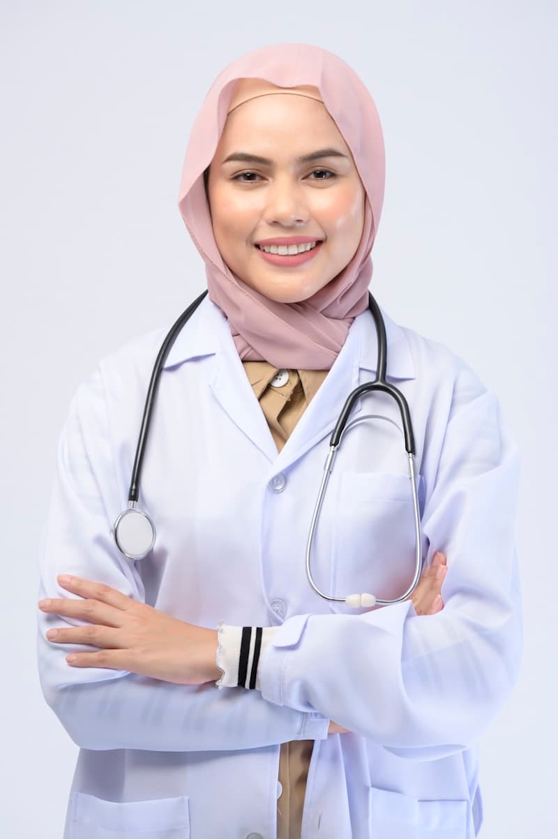 Healthcare professional in hijab wearing white coat with stethoscope